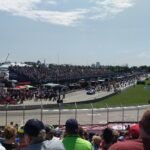 people watching football game during daytime